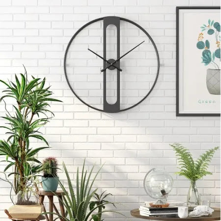 Round metal wall clock measuring 50cm in diameter available in black or gold colour