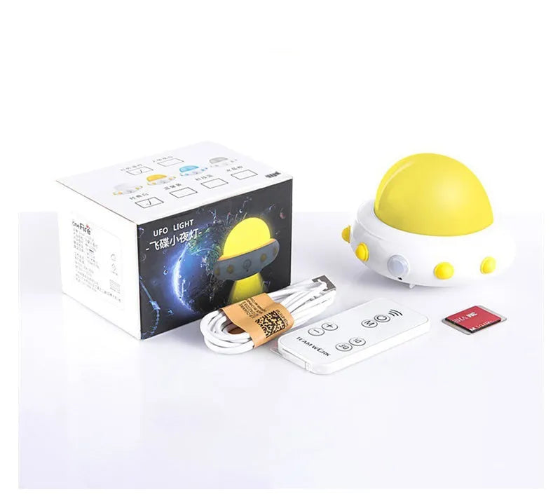 Remote control UFO-shaped bedside night light in blue, pink, or white colours.
