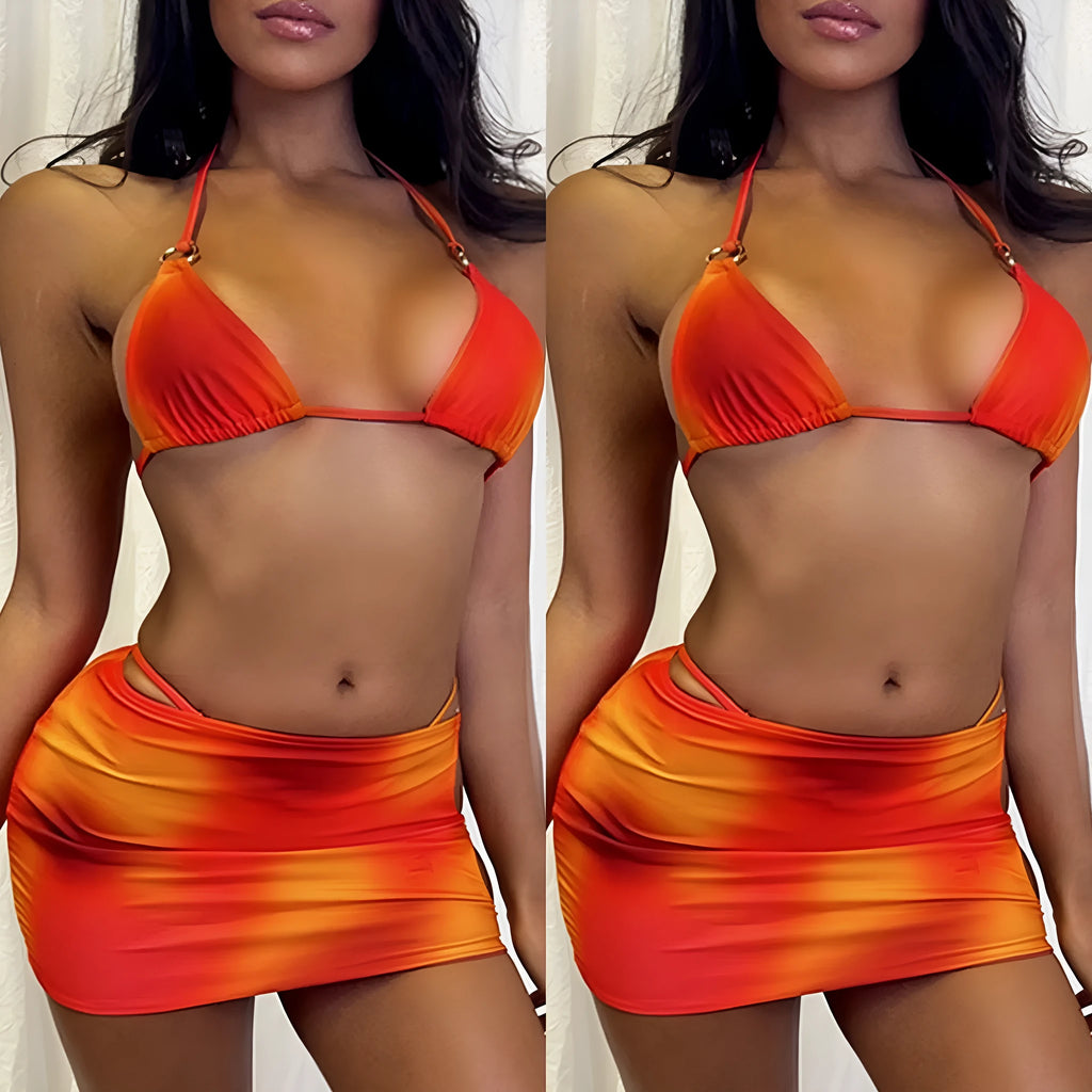 Solid colour tie-dye gradient three-piece halter bikini swimsuit set with skirt on hanger.