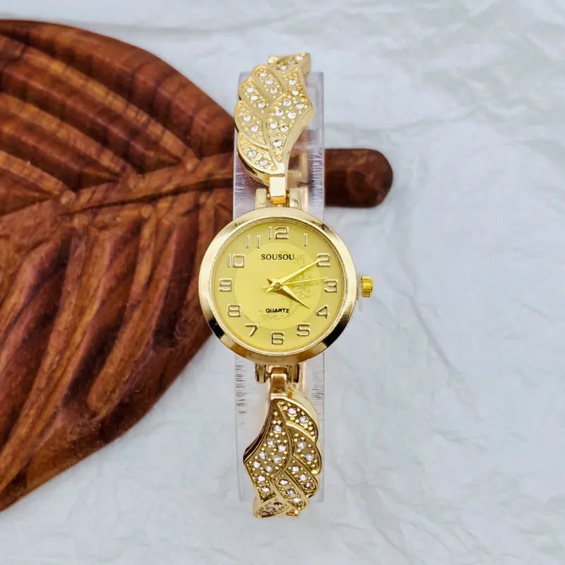 Women's stainless steel watch with round dial and Vachette clasp buckle showing gold face option