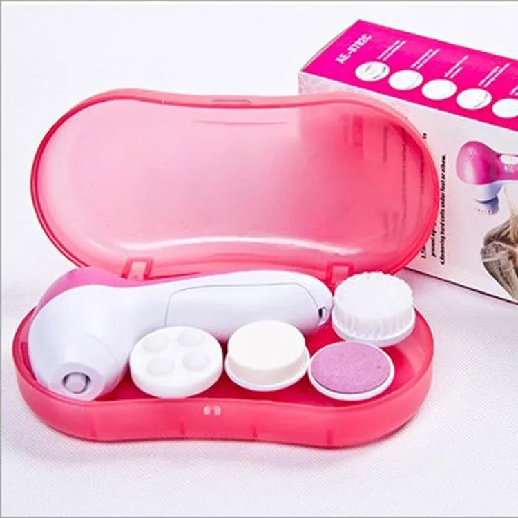 Pink electric facial cleanser with soft brush attachment and roller massager on white background, compact size