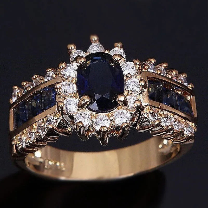 Personalised zinc alloy ring with blue diamond or coloured zircon designs in sizes 6 to 11.