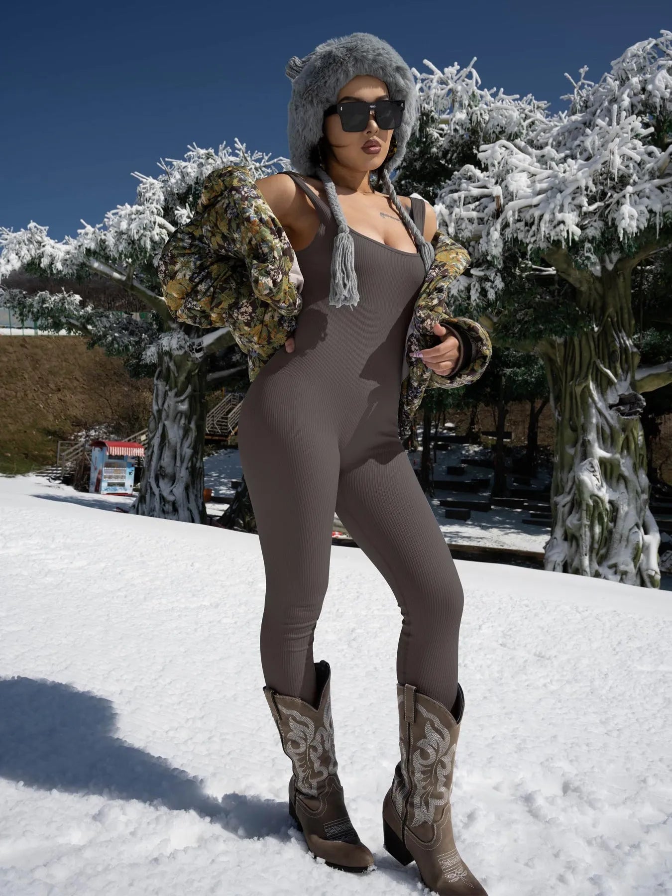 Women's long sleeve suspender tank top tights in spandex fabric on a hanger.