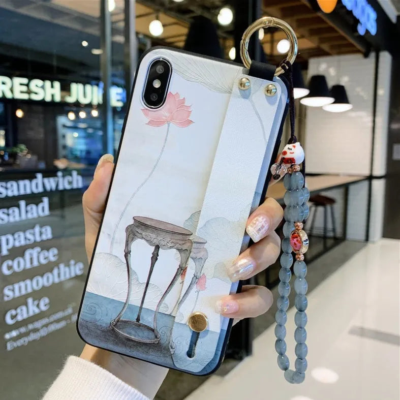 Rose flower pattern TPU phone case for iPhone with a built-in wrist strap loop on the corner.