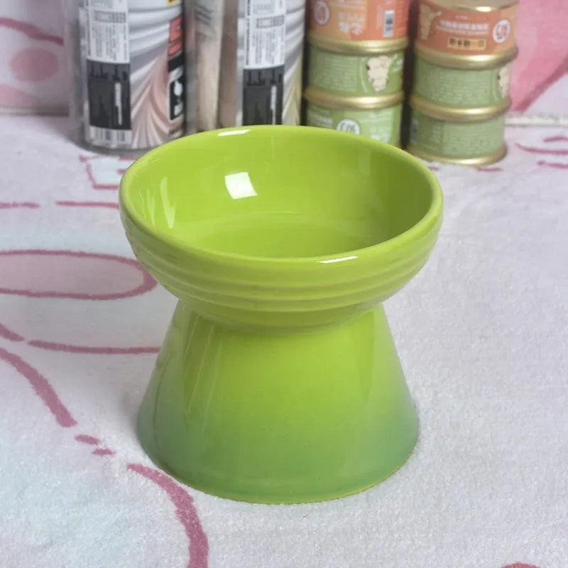 Ceramic anti-tumble pet bowl for dogs and cats with high foot and neck protector.