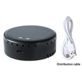 Black solar-powered car air humidifier mounted on a vehicle's air conditioning vent.