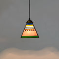Small stained glass pendant light with coloured glass shade and long drop cable.