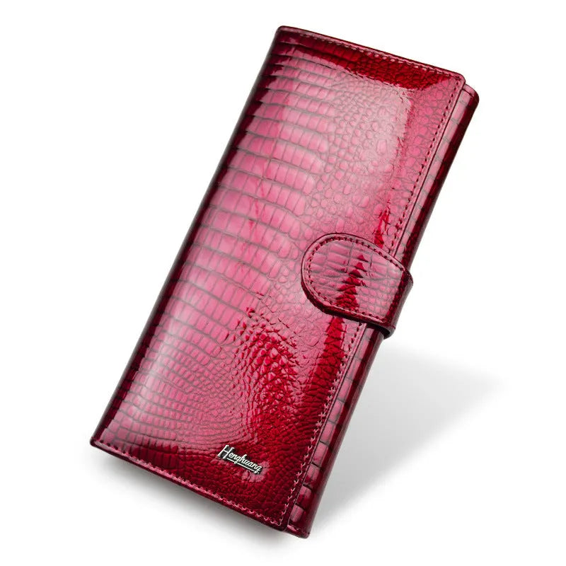 Women's leather coin purse with patent leather crocodile pattern texture in wine red colour