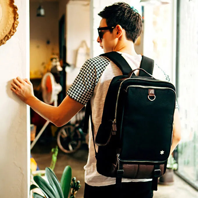 Modern men's Oxford cloth backpack in seven colour options showing 30x16x46cm dimensions