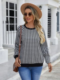 Black long sleeve pullover sweater with printed plaid and stripe pattern design.