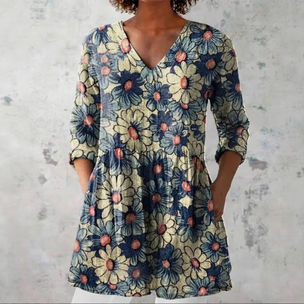 Women's retro-style slim fit long-sleeved top with a printed pattern, shown in one of twelve available colours.