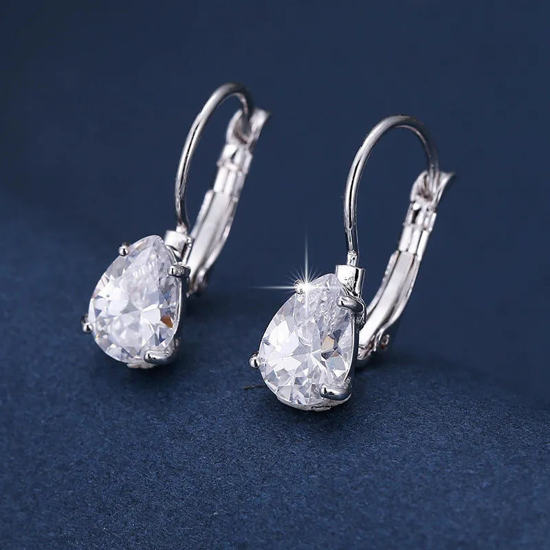 Drop-shaped copper earrings with platinum gem decoration in gold and platinum colour options