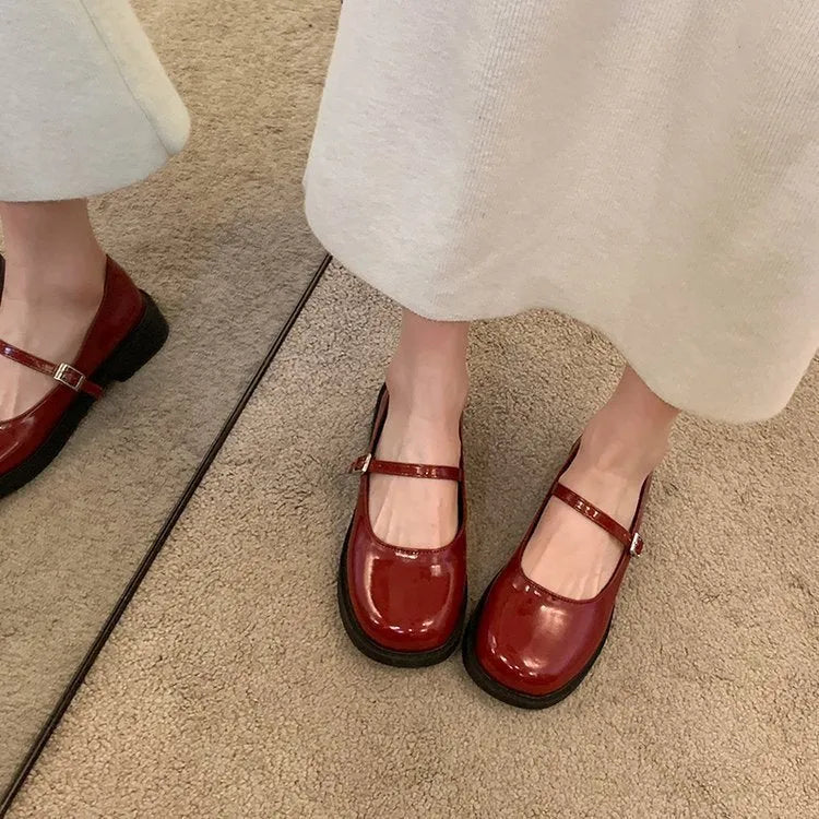 Women's solid colour French vintage flat shoes with round toe in red, light black, or matte black.