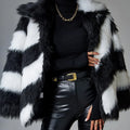 Women's faux fur coat with a contrasting colour lapel and a large fur collar.