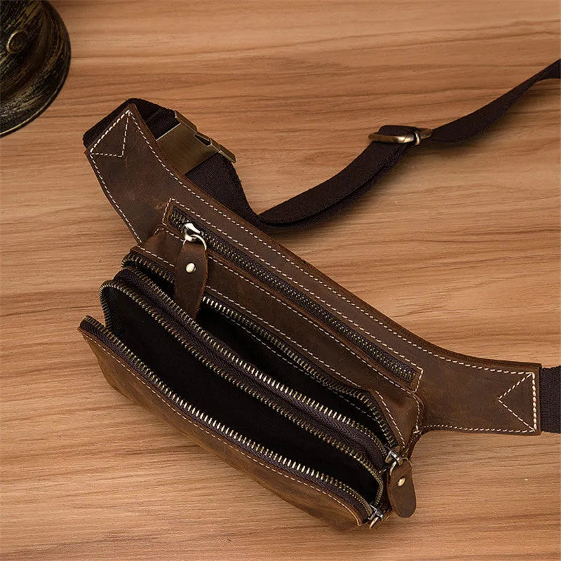 Brown top layer cowhide leather men's sports waist bag with pull closure.