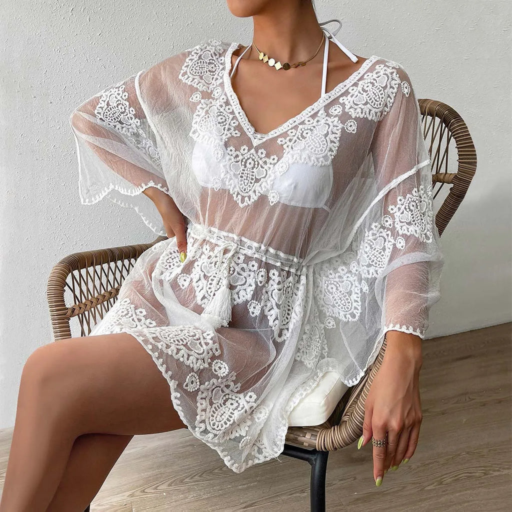 White water-soluble polyester beach blouse for swimming and sun protection.