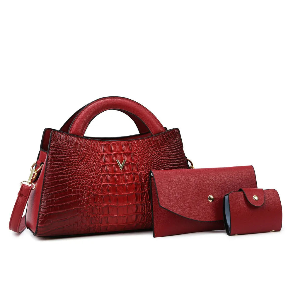 Square black women's crossbody bag with crocodile pattern texture and a single shoulder strap.