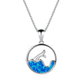 Close-up of a women's electroplated copper necklace with a geometric fishtail tail pendant in a blue opal colour.