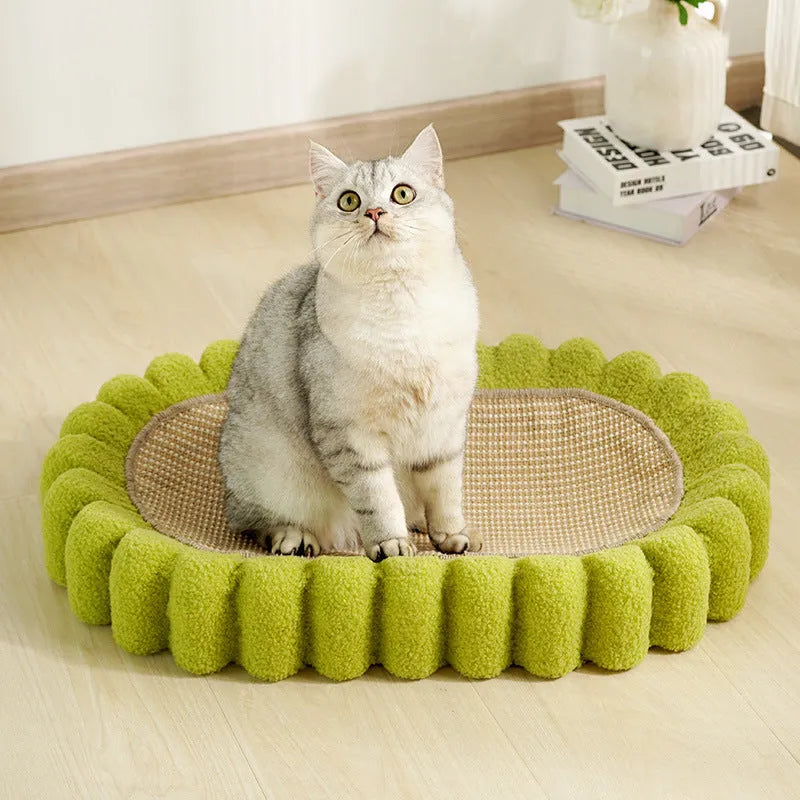 Green oval-shaped cat scratch pad and lounge bed made from textured sisal fabric.