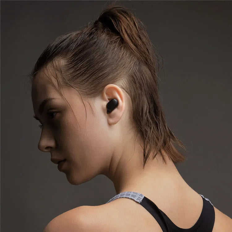 Black Redmi AirDots 2 true wireless earbuds with their compact charging case.