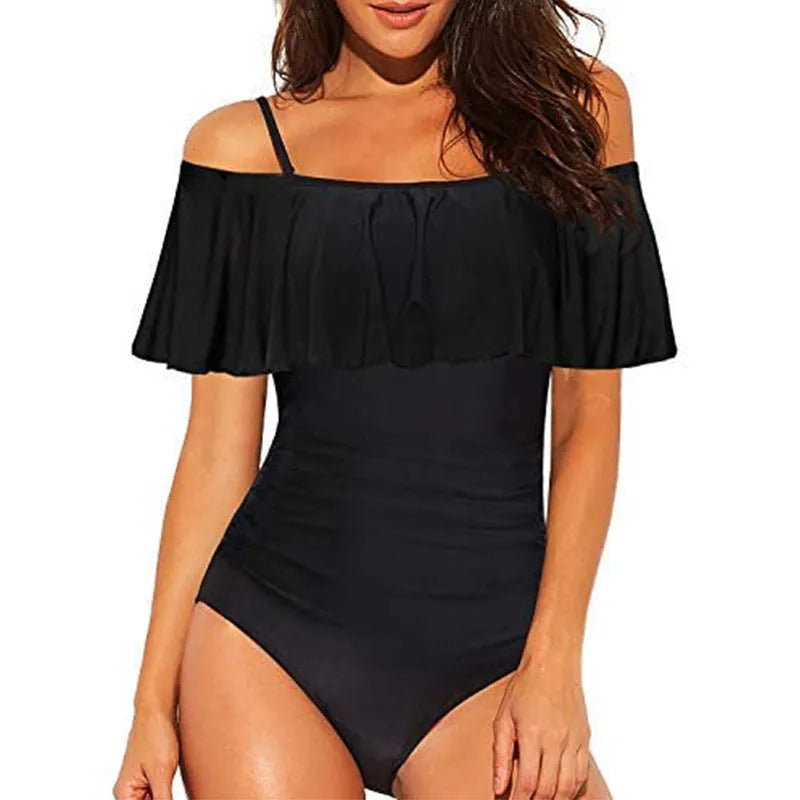 Black one-piece swimsuit with cut-out ruffled straps on a tube top
