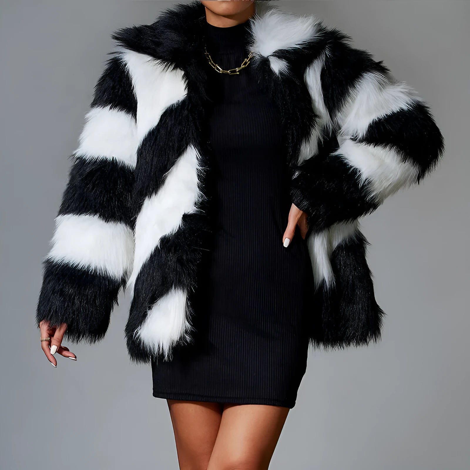 Women's faux fur coat with a contrasting colour lapel and a large fur collar.