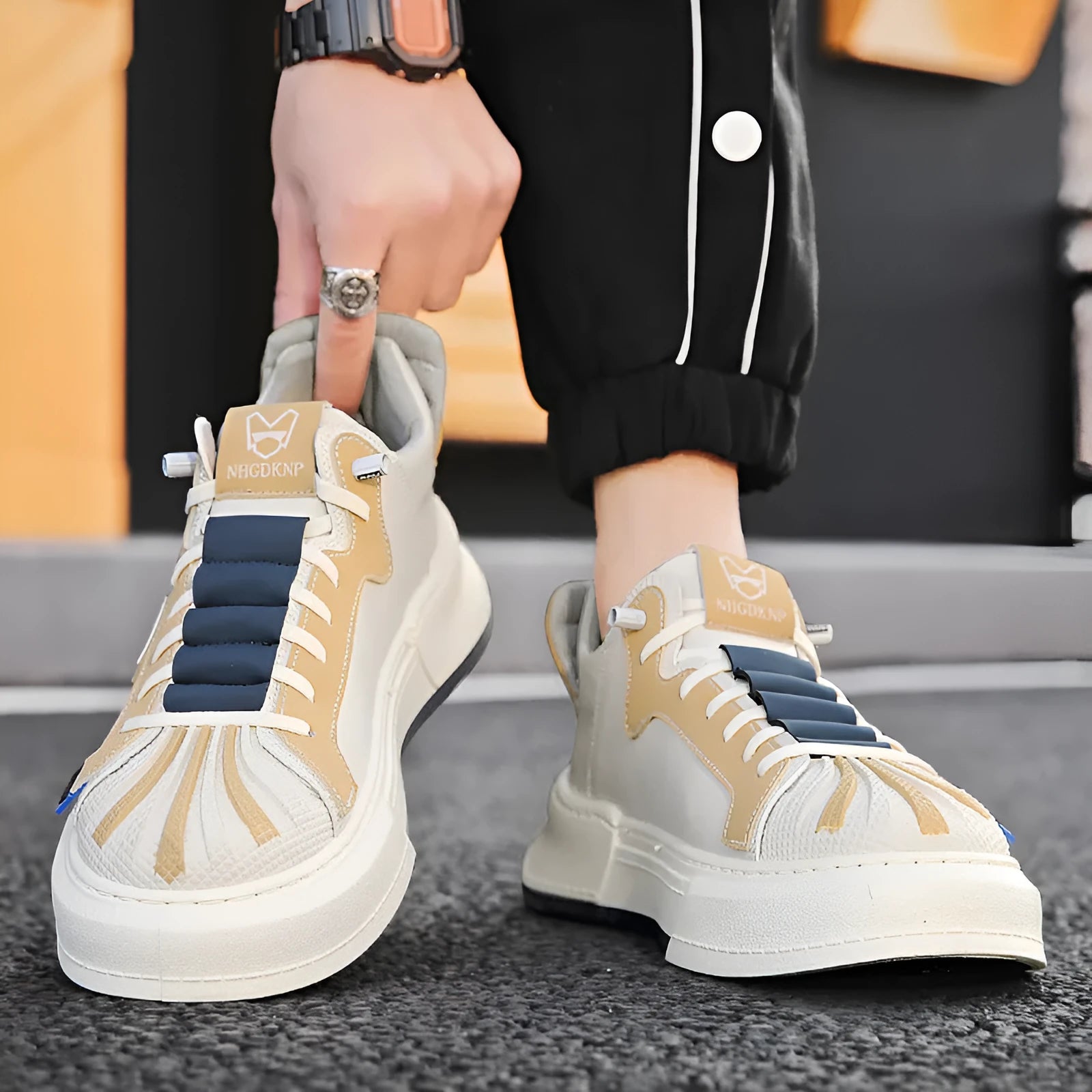 Men's beige and black casual sneakers with elastic band closure and microfiber upper