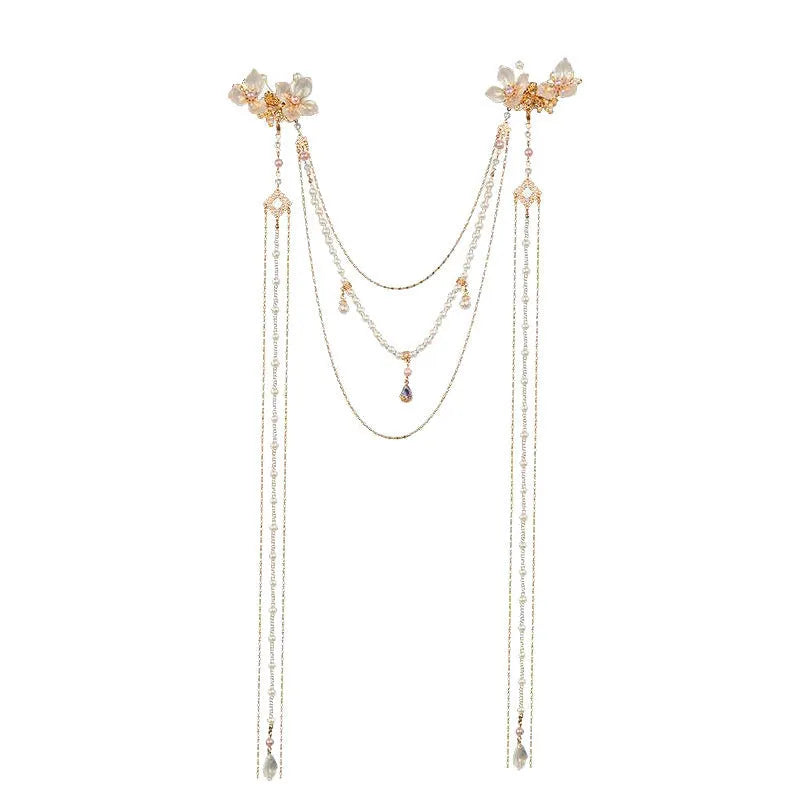 Gold women's hairpin with white pearl and clear diamond floral decoration and a long dangling tassel