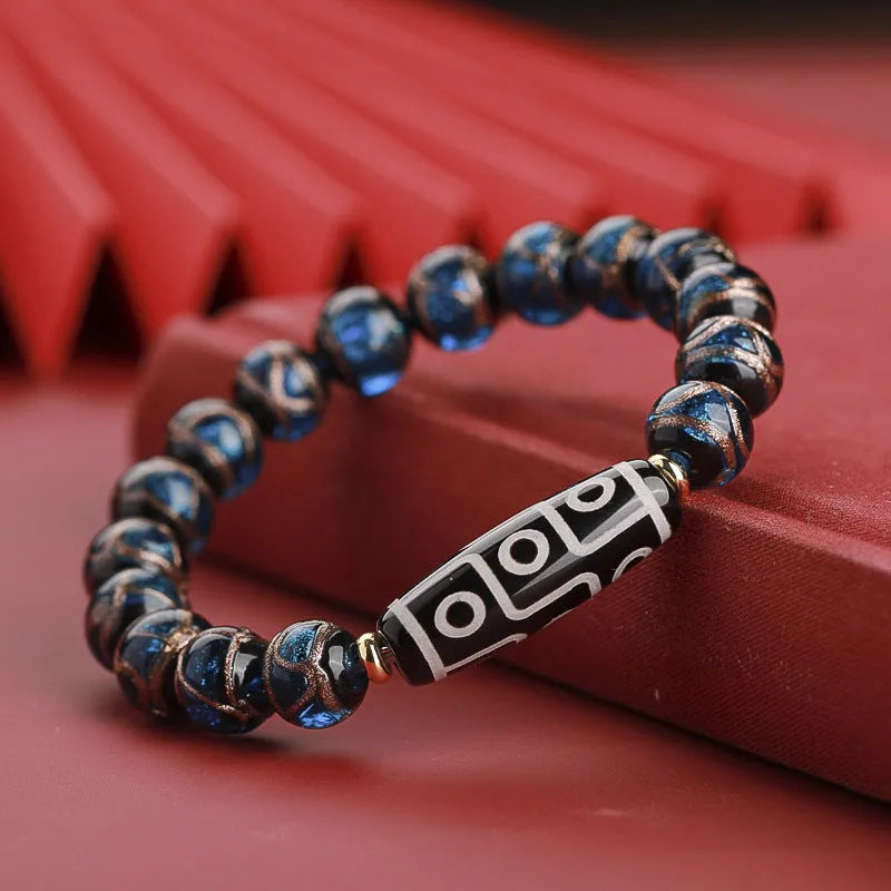 Snake year lucky bracelet with multicoloured glazed beads in Chinese auspicious patterns.