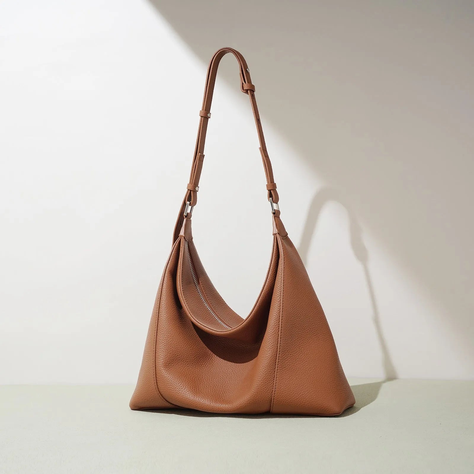 First layer cowhide soft leather shoulder bag in beige with pillow shape and open outer pocket