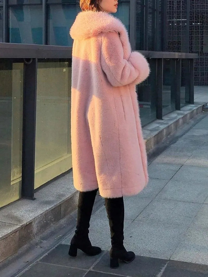 Grey women's mid-length faux fur coat with a thick plush texture and matching fur collar.