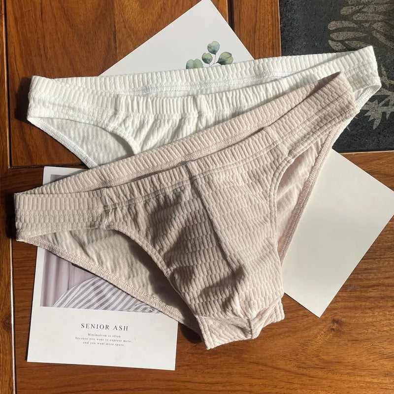 Men's solid colour pure cotton triangle underwear briefs in mid-waist style on a white background.