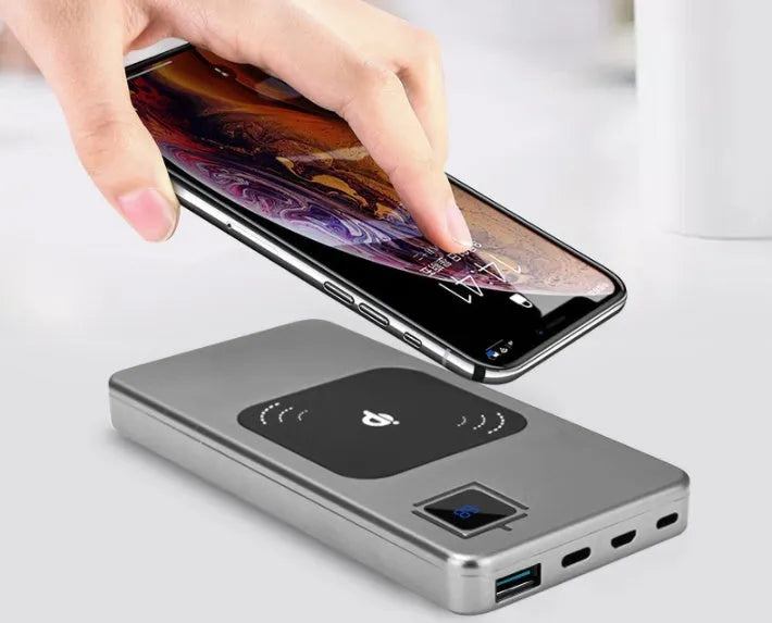 Alloy shell portable power bank with LCD display in black, silver, red, or blue.