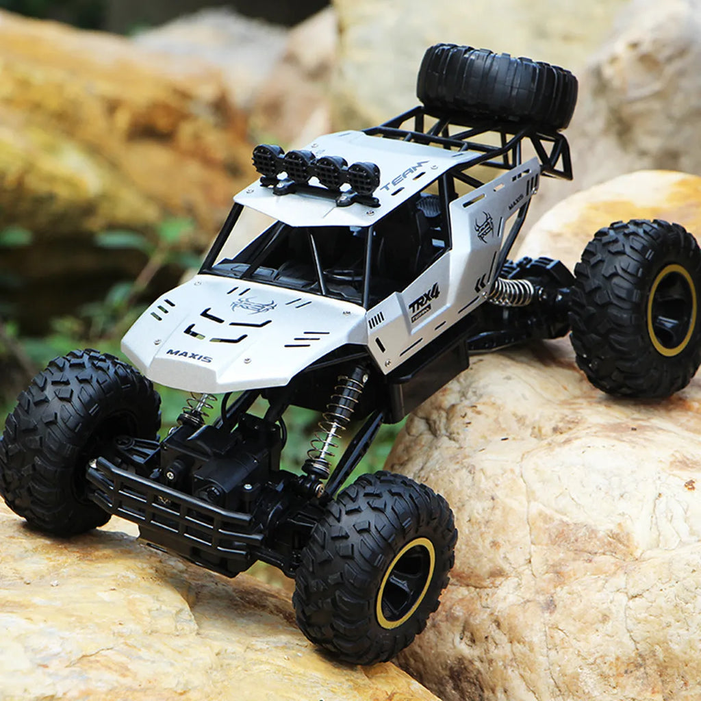 Large black 2.4G remote control four-wheel drive off-road climbing car on rough terrain