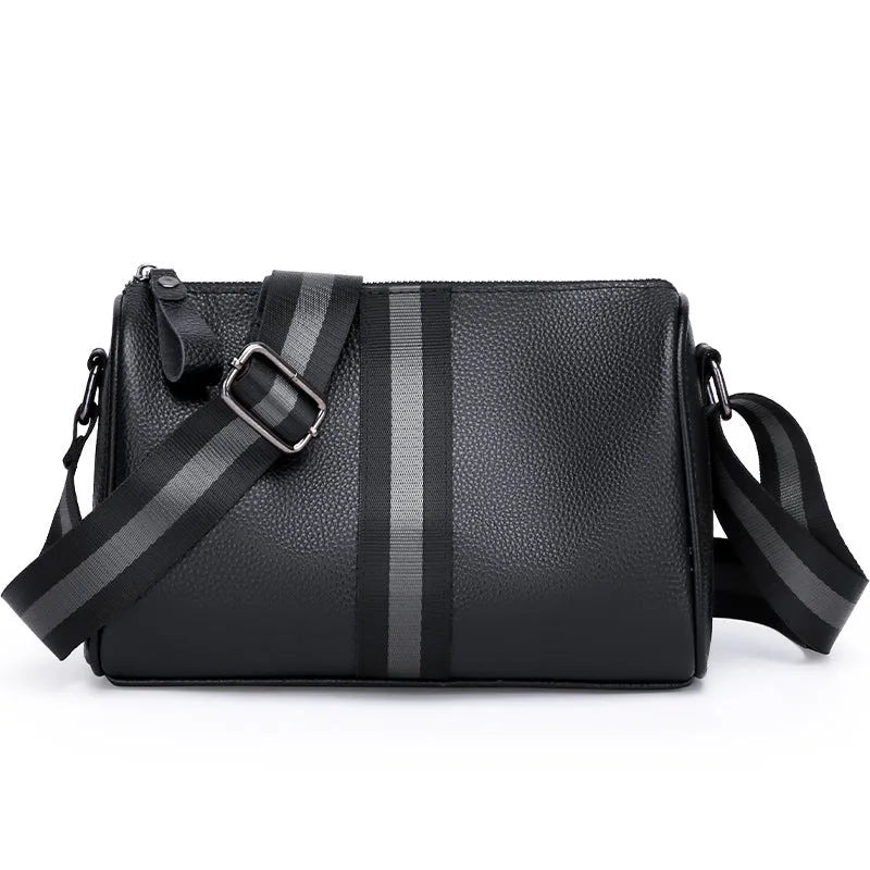 Black genuine leather crossbody bag with one shoulder strap showing interior polyester lining