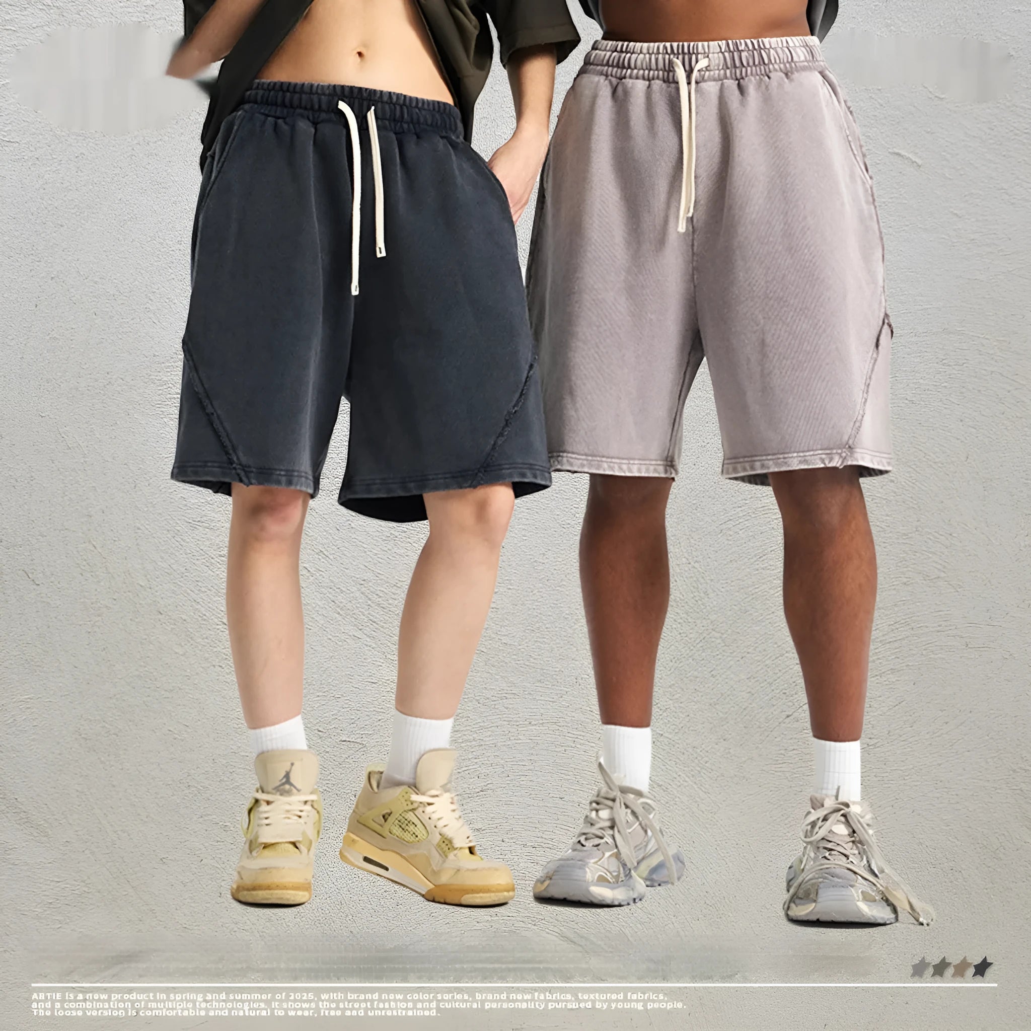Man's loose-fit cotton terry shorts in a batik wash colour with a craft patch detail, shown in a street fashion style.