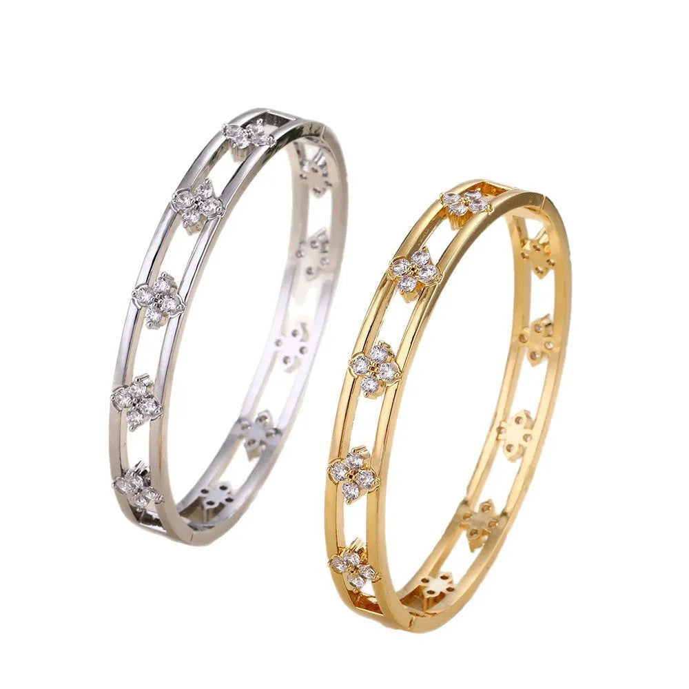 Women's hollow bracelet with zircon four-leaf clover design in gold or silver