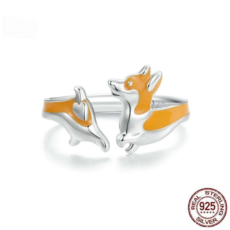 Silver ring with a raised cartoon corgi dog design and electroplated colour finish.