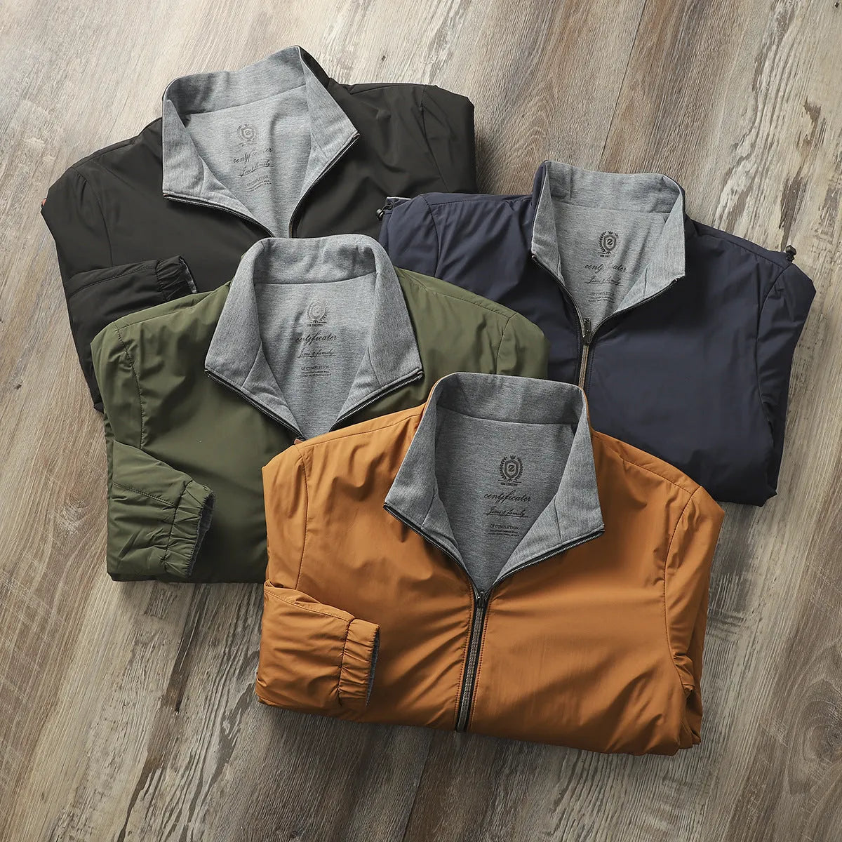 Men's stand collar casual jacket in army green, shown on a model, featuring a simple design with a cotton-lined interior.