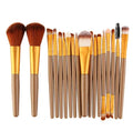 MAANGE 18 piece makeup brush set with fan brushes open next to its black roll-up case.
