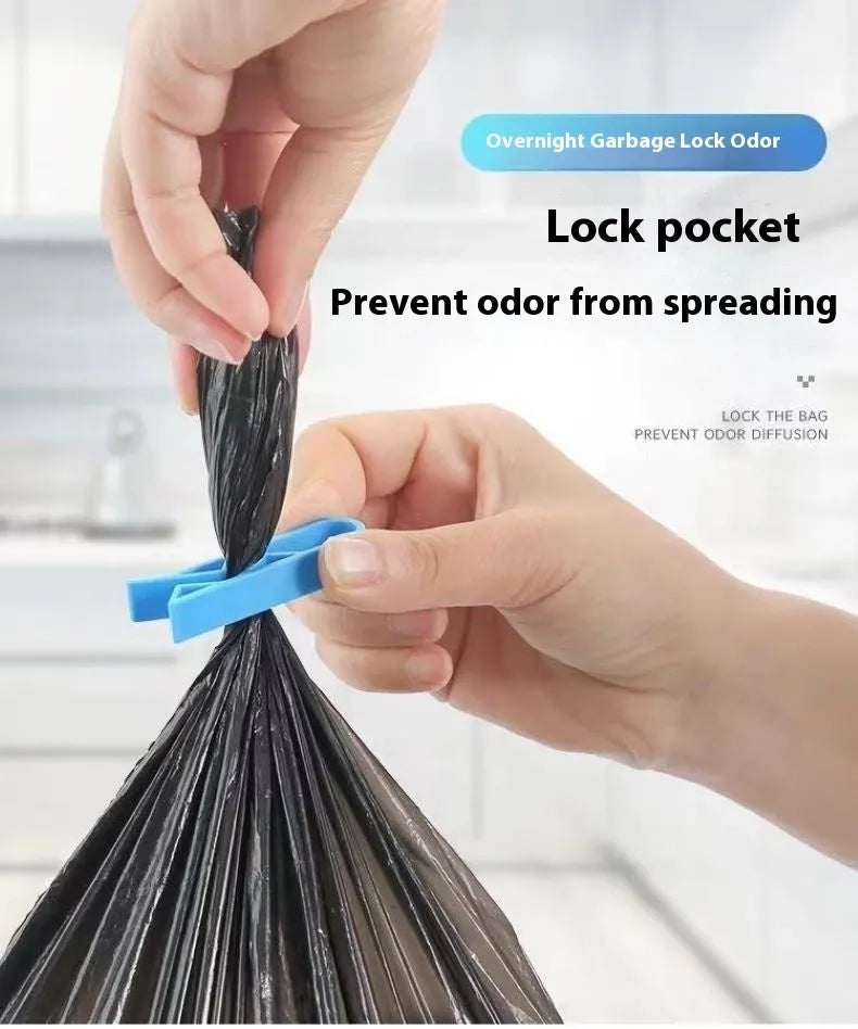 PP plastic bin bag fixing clip attached to a rubbish bin rim holding a liner in place.