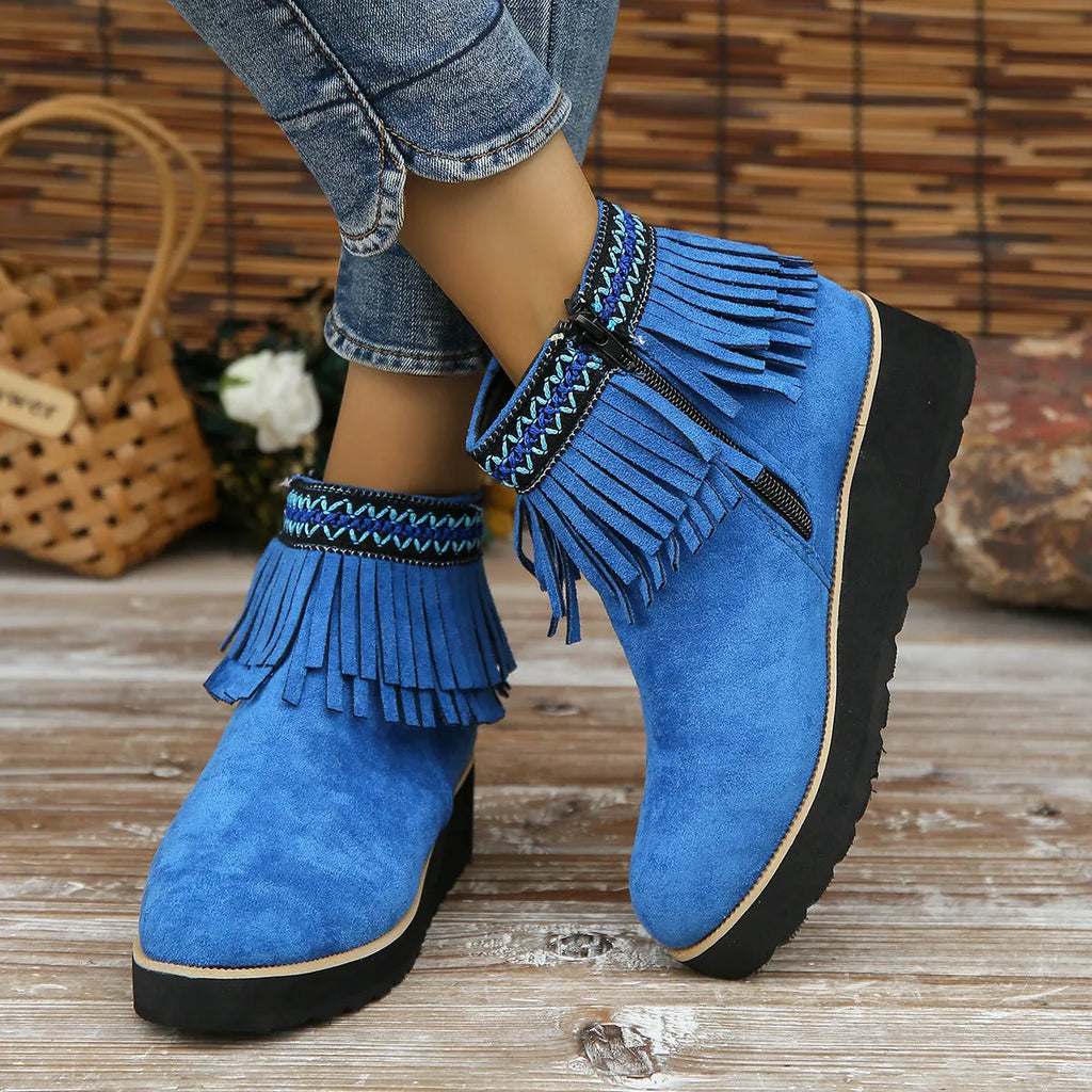 Women's suede wedge ankle boots in dark brown with a side zipper and tassel detail.