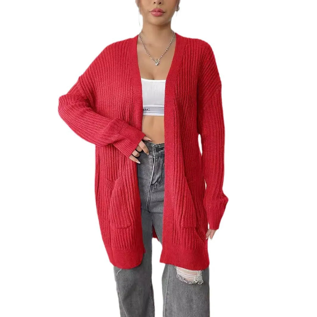 Women's double pocket cardigan in acrylic fabric showing loose fit and 65cm length