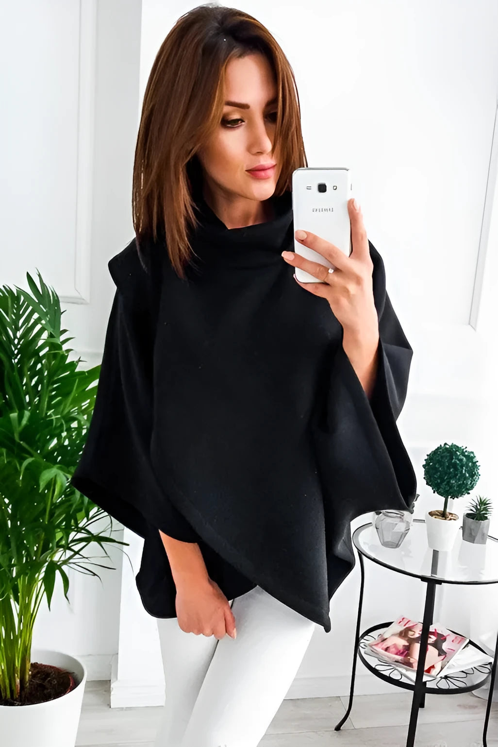 Long grey women's cardigan with batwing sleeves and three-button placket.