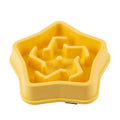 Yellow plastic dog slow feeding bowl with rough bottom pattern, 20.1cm diameter, isolated on white background