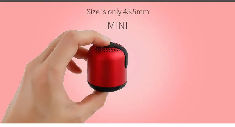Hieha XQ11 cylindrical mini Bluetooth speaker in silver metal finish, showing compact size.