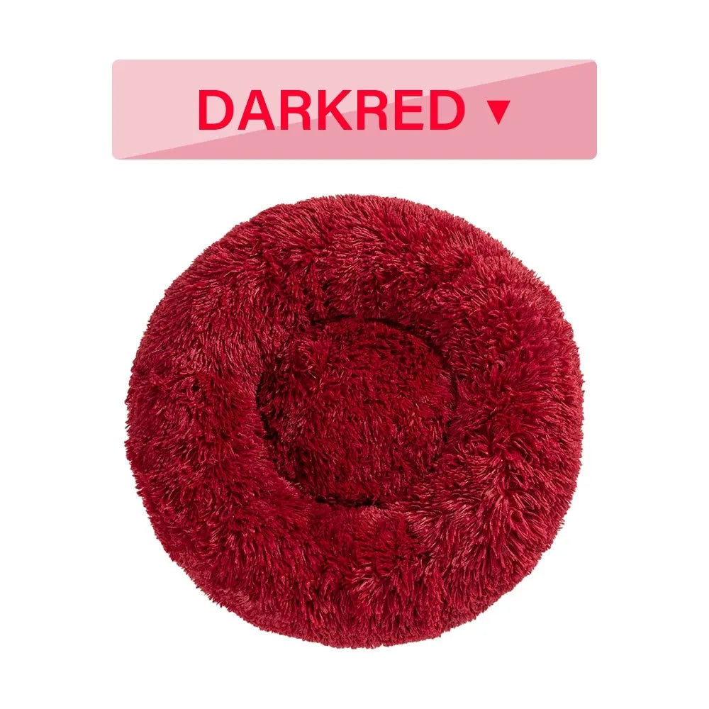 Fluffy donut-shaped dog bed with raised edges in luxury long plush fabric