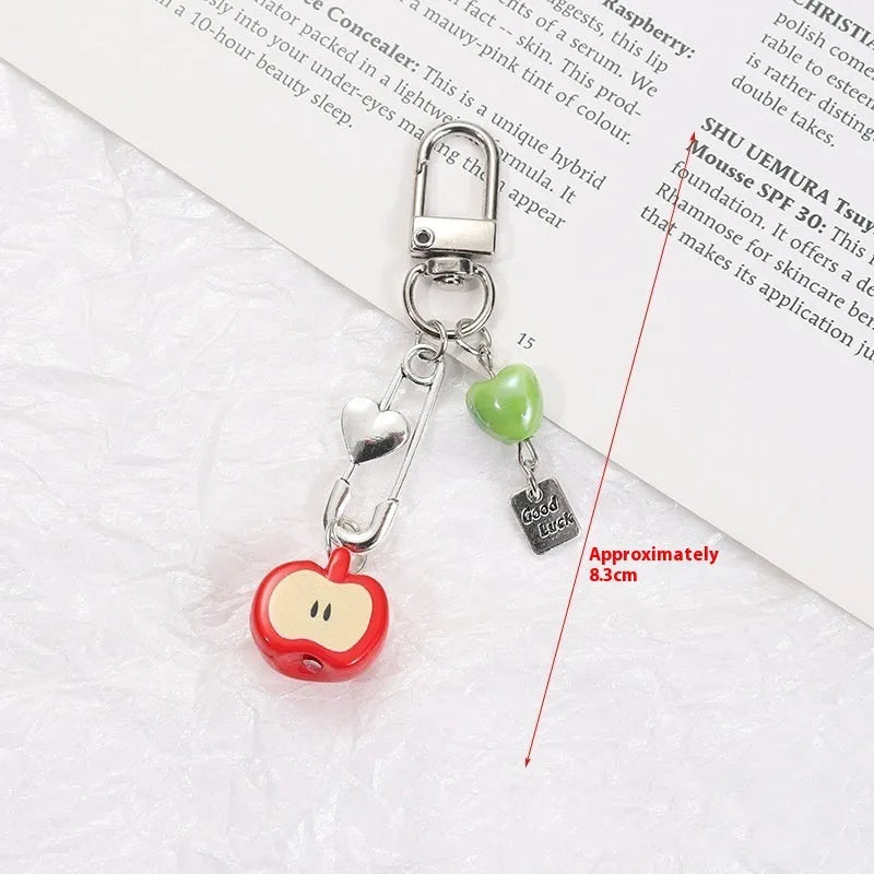 Mobile phone earphone bag pendant keychain with fruit designs including apple, strawberry, and apple core patterns