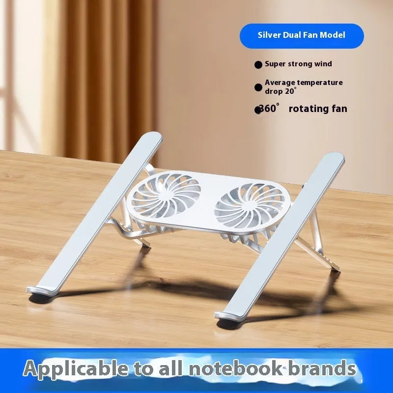 Silver aluminium laptop stand with twin cooling fans in folded position beside notebook computer