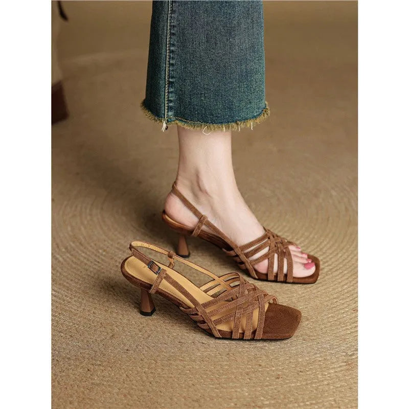 Retro-style women's sandals with thin cross straps, an ankle buckle, and a square toe in a light brown colour.